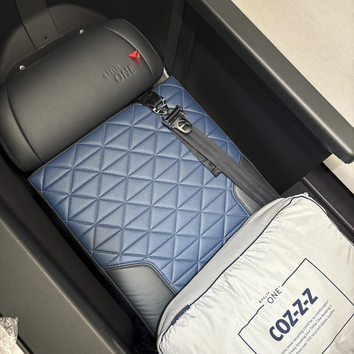 Delta One seat in lie-flat bed mode without a mattress pad on A330 900neo