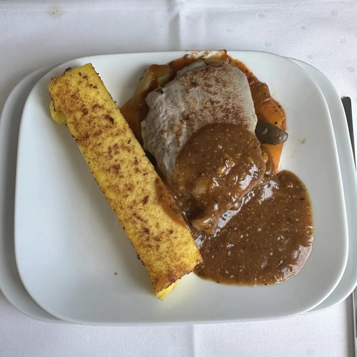 Lufthansa Airlines business class veal steak and polenta entree.