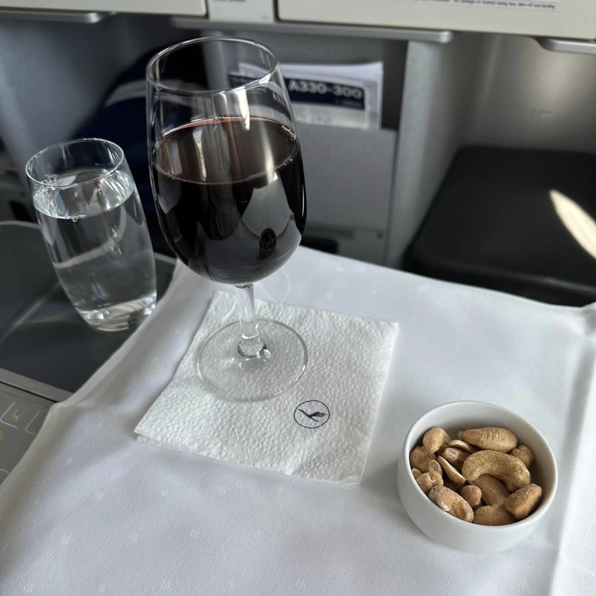Lufthansa Airlines business class pre-departure drink and nuts