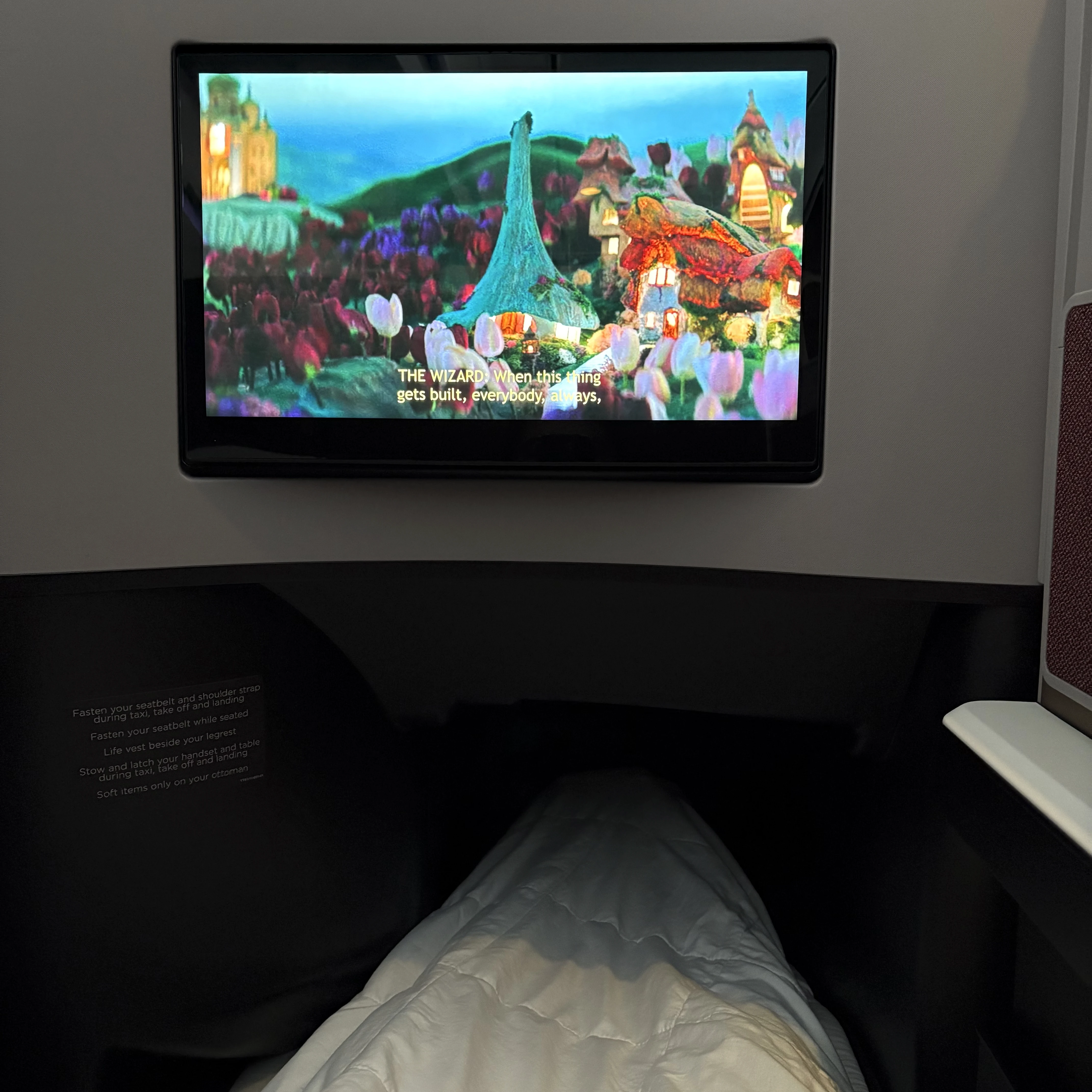 Virgin Atlantic Upper Class in-bed TV screen showing HD entertainment system layout.