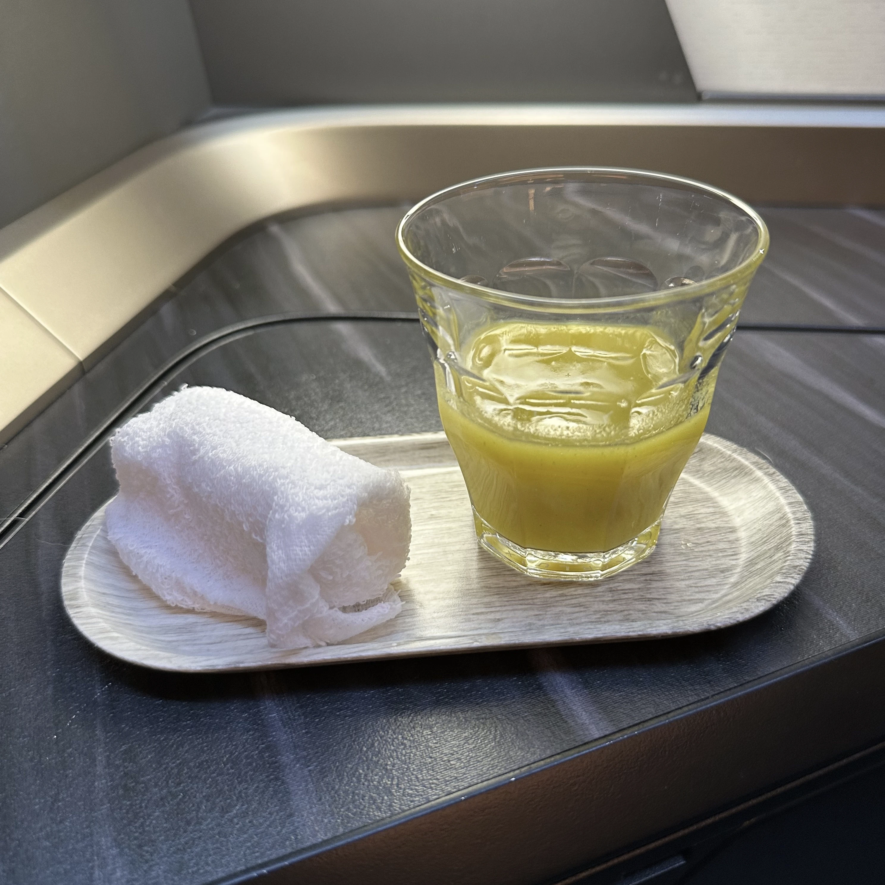 Starlux Airlines A350 business class gives passengers a honey cucumber pre-departure drink.